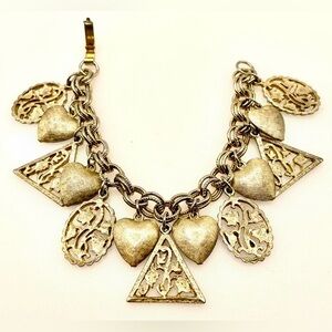 Vintage Silver Tone Charm Bracelet. Hearts and Openwork Floral Design Charms